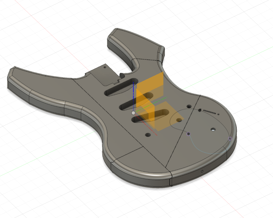 3D model of the guitar body in Fusion, split into interconnected pieces with the pieces separated in place