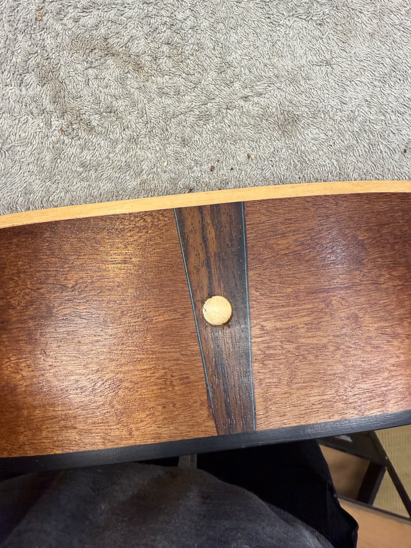 Bolted neck joint and strap pin on the finished sapele body