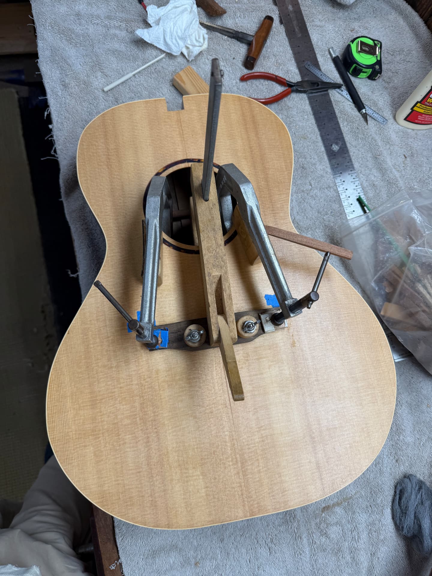 Bridge glued and clamped to the spruce top of the guitar body